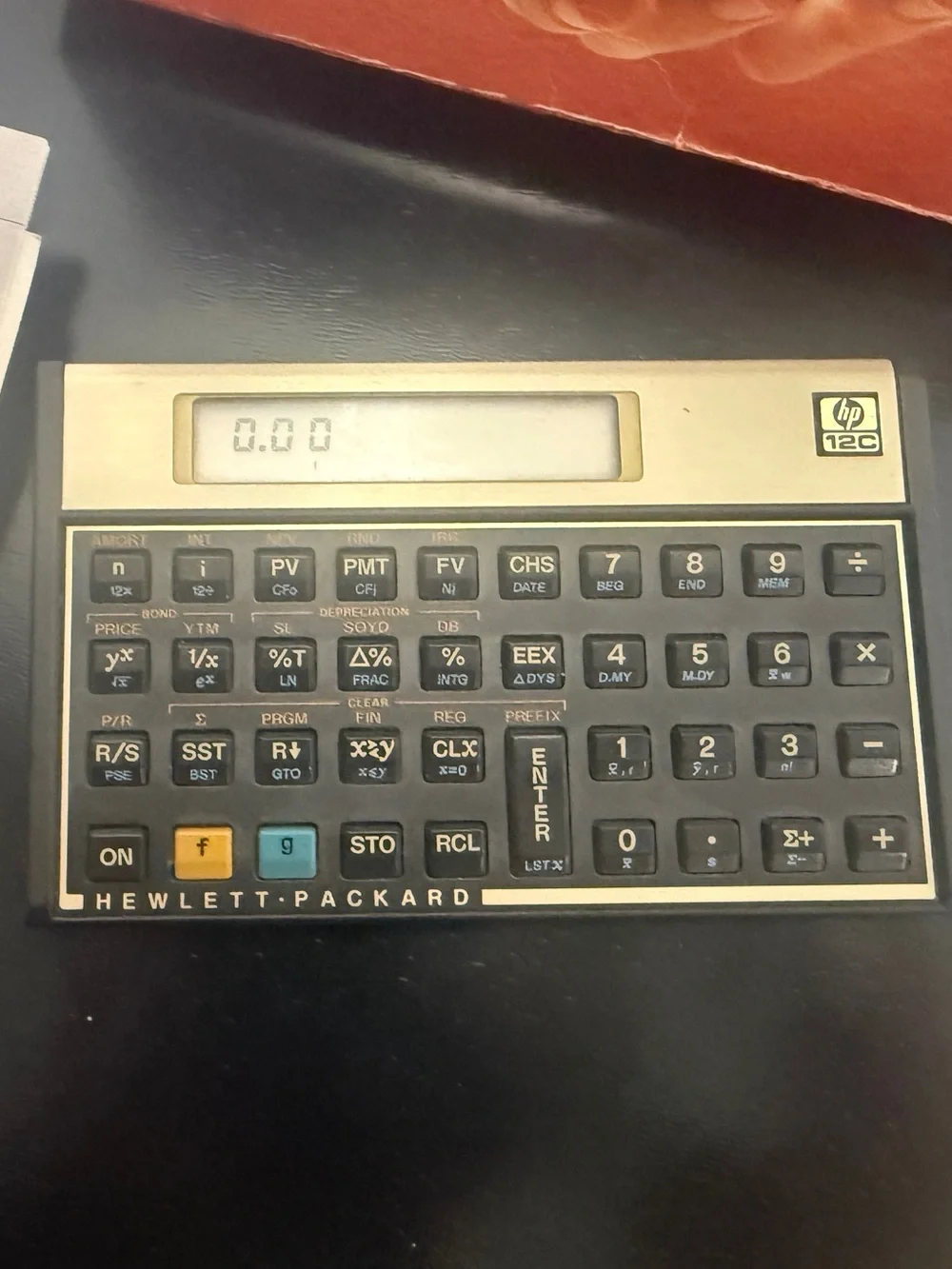 Vintage 1980’s Hewlett-Packard HP-12C Financial Calculator with Manuals
